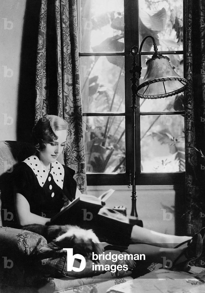 Woman reading, 1935 (b/w photo)