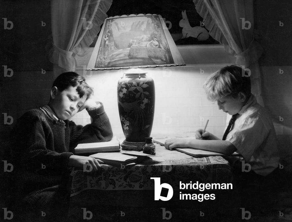 Students doing their homework, 1932 (b/w photo)