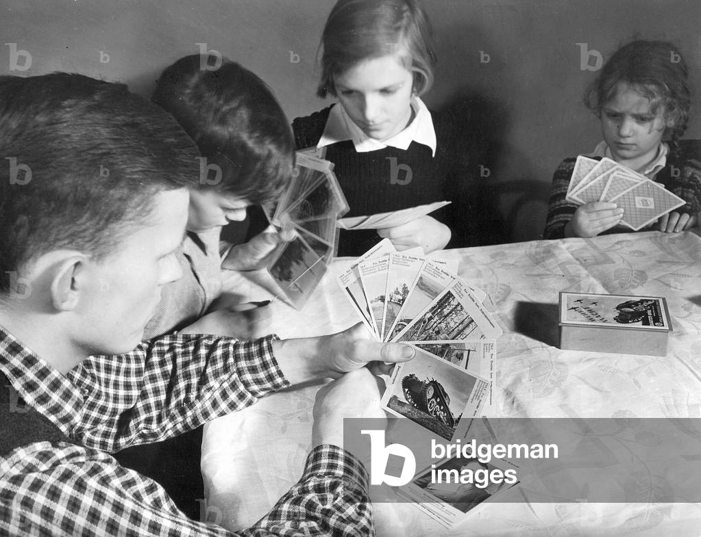 Children play cards, 1937 (b/w photo)