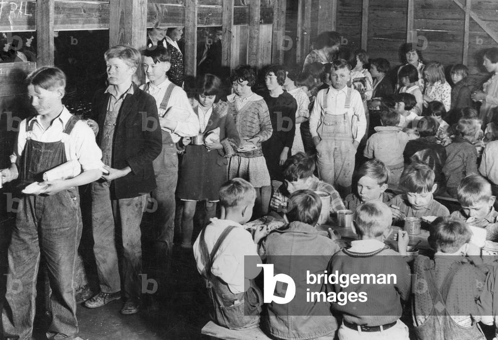 Feeding the children of unemployed farmers in the U.S., 1932 (b/w photo)