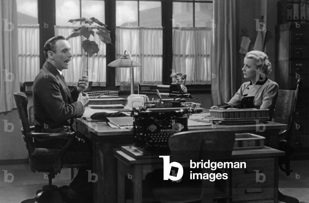Office worker in the office, 1934 (b/w photo)