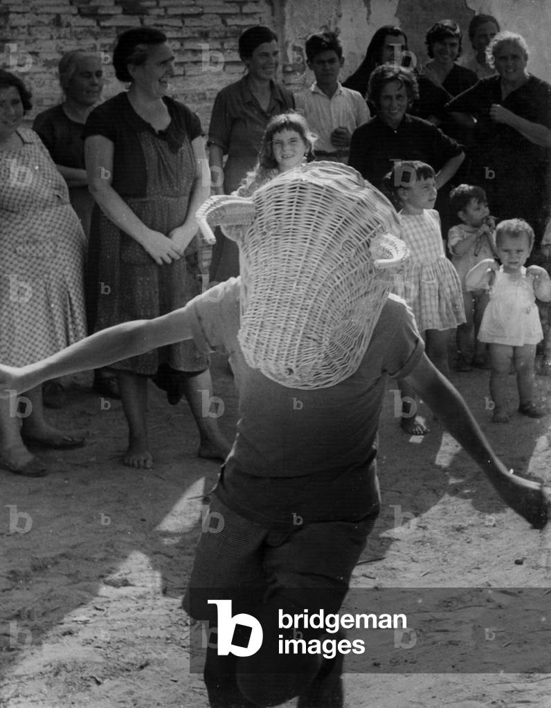 Children play bullfighting in an andalusian village (b/w photo)