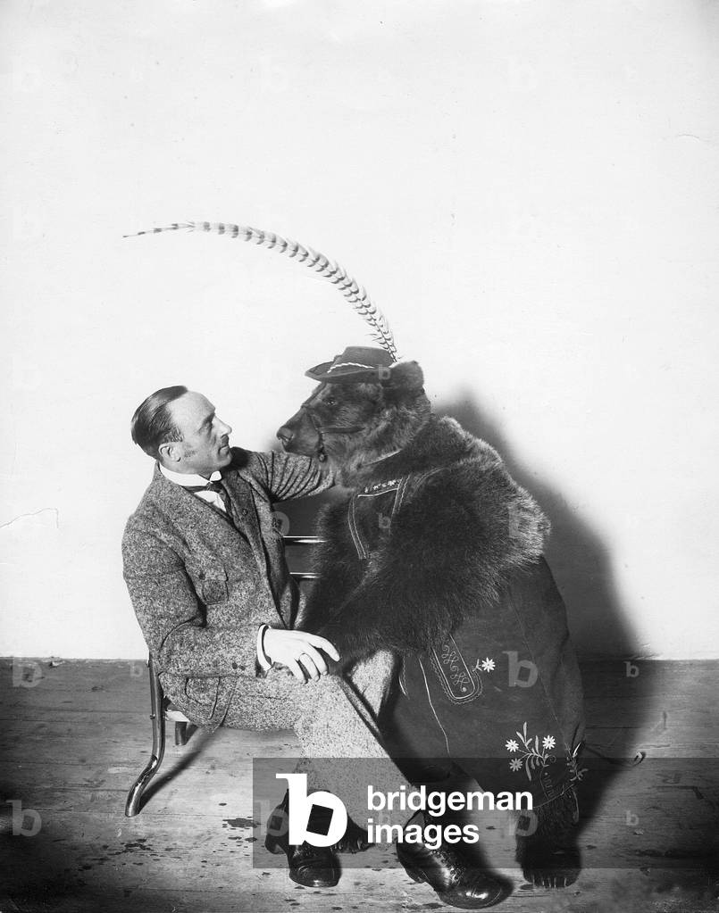 Circus animal trainer with a bear, 1924 (b/w photo)