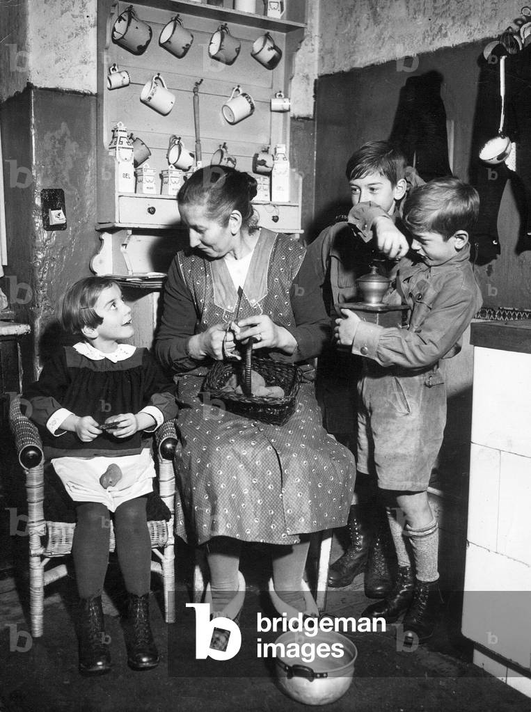 Mother with her children, 1936 (b/w photo)