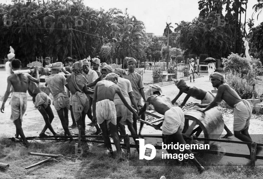 Road construction in India, 1939 (b/w photo)