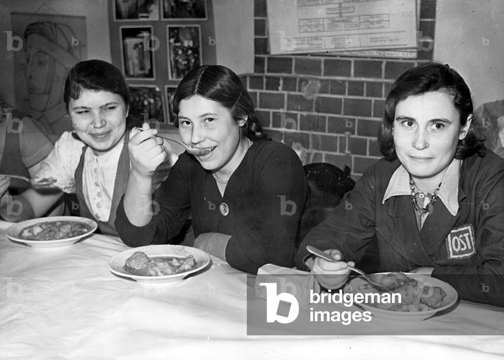 Forced Laborers during lunch in the Berlin Publishing house Scherl, 1943 (b/w photo)