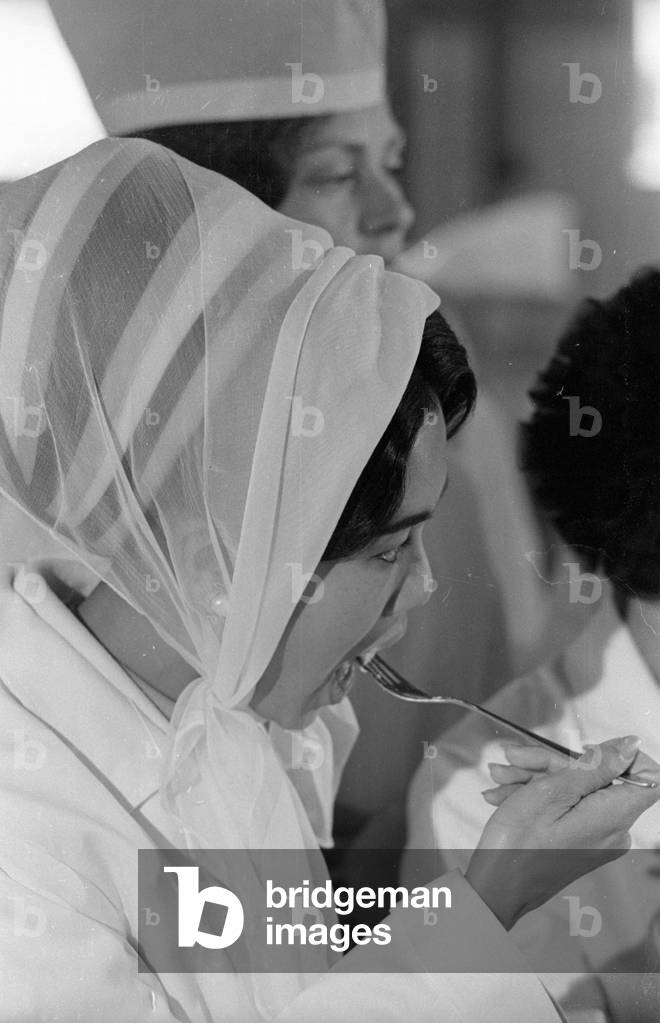 The Thai royal couple in a fish factory in Bremen, 1966 (b/w photo)
