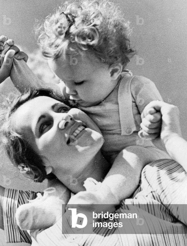 Mother with child, 1938 (b/w photo)