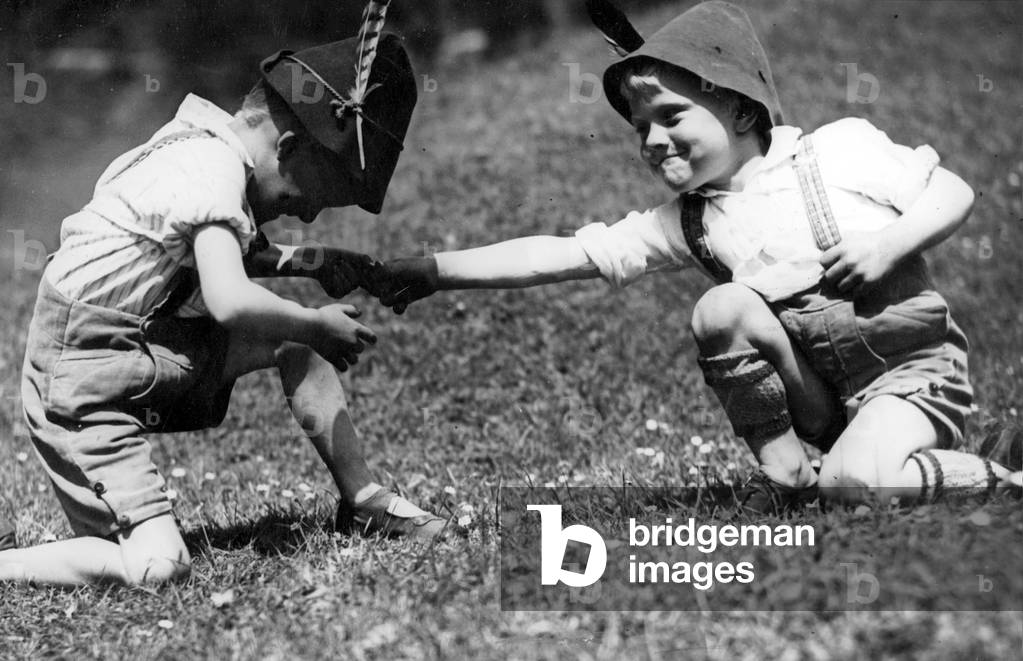 Two boys finger wrestling, 1933 (b/w photo)