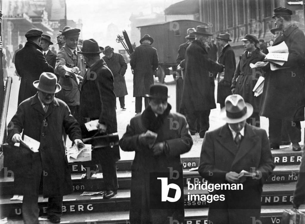 Crowd of people with flyers, 1933