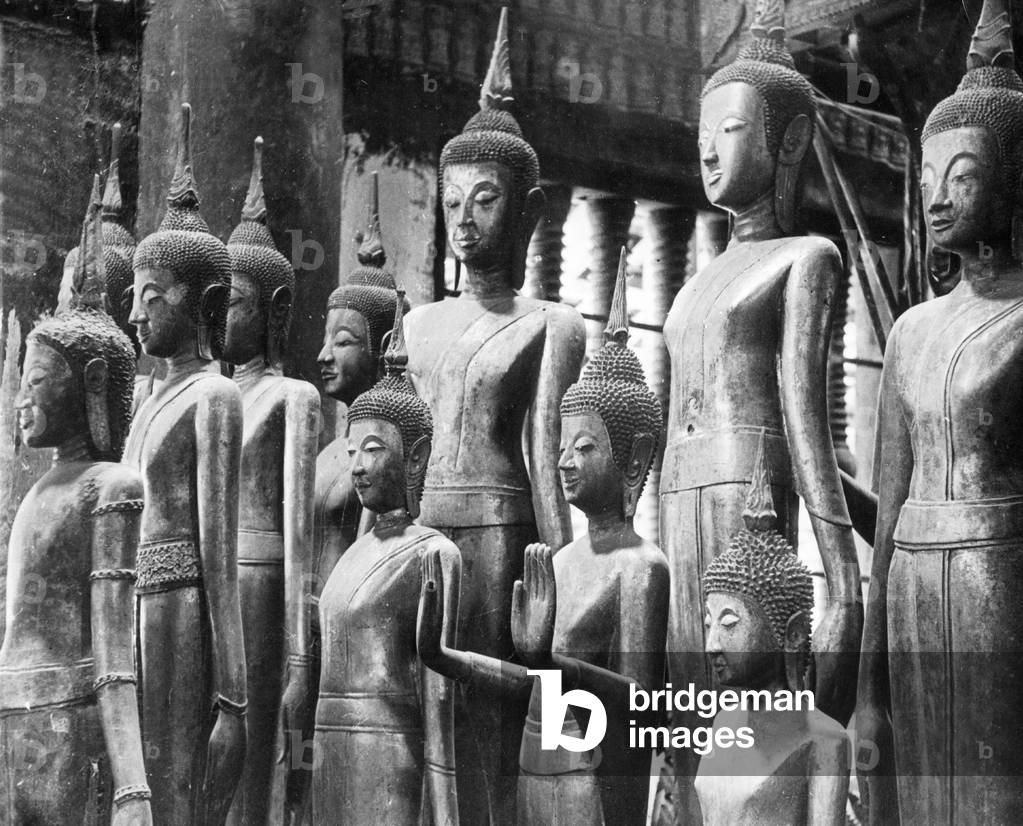 Buddha statues (b/w photo)