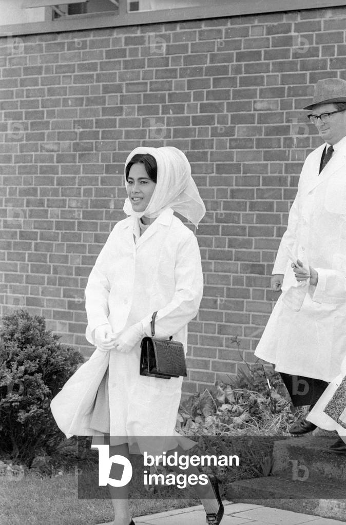 The Thai royal couple in a fish factory in Bremen, 1966 (b/w photo)