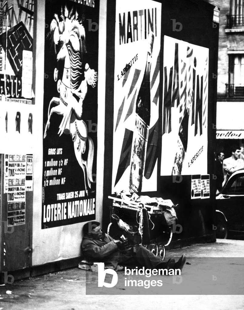 A homeless man in Paris, 1960 (b/w photo)