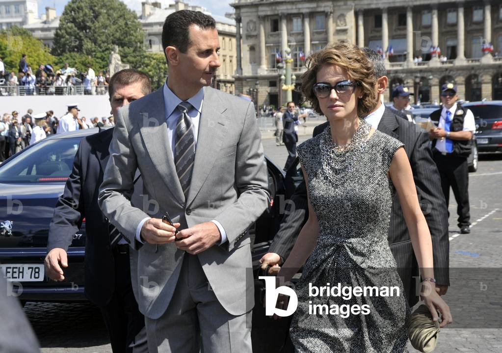 Bashar Al-Assad, Syrian President, with his wife, at a military parade on the French national holiday as part of the Mediterranean Union summit in Paris, 14th July 2009 (photo)