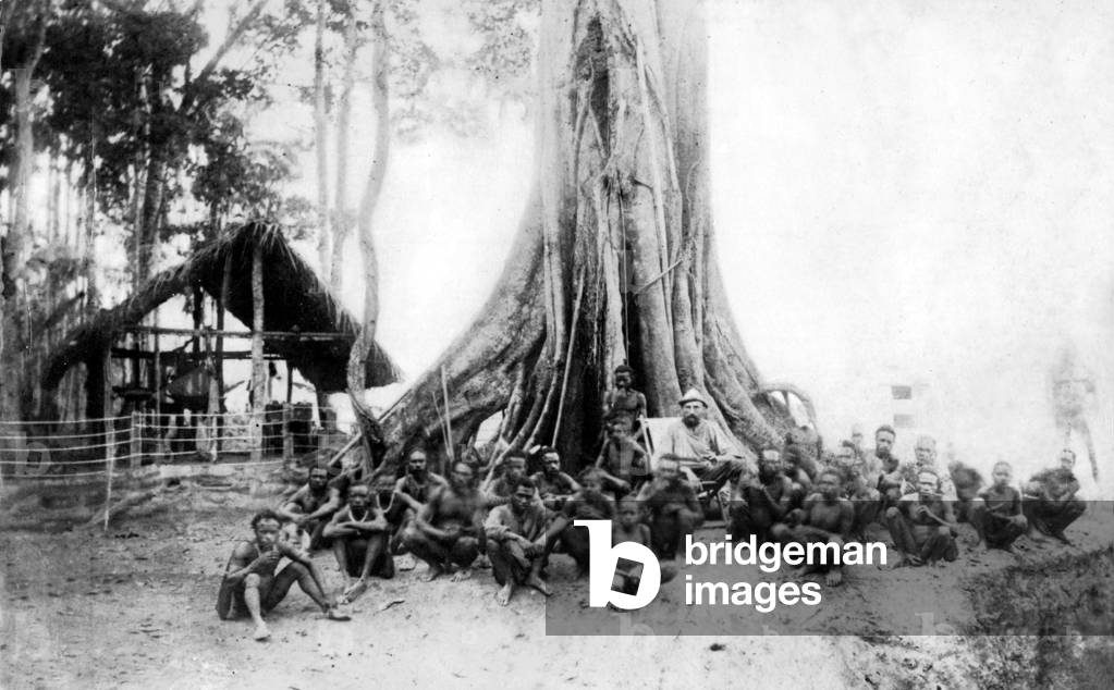 Natives and a German administrator (b/w photo)