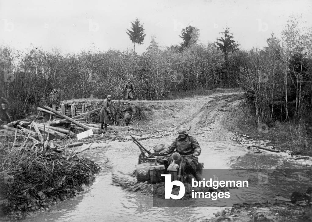 German soldier with motorcycle, 1941 (b/w photo)