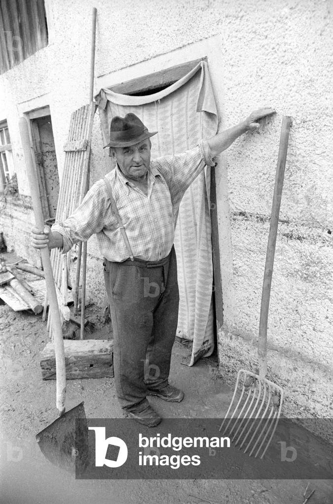 Cleaning up after a storm at Lake Chiemsee, 1974 (b/w photo)