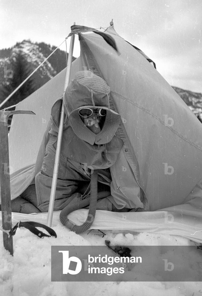 Mountaineer Mathias Rebitsch during preparations, 1954 (b/w photo)
