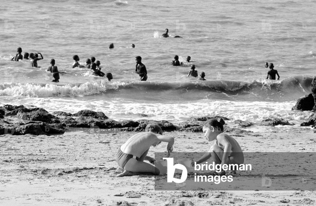 Children on the beach in Guinea, 1960s (b/w photo)