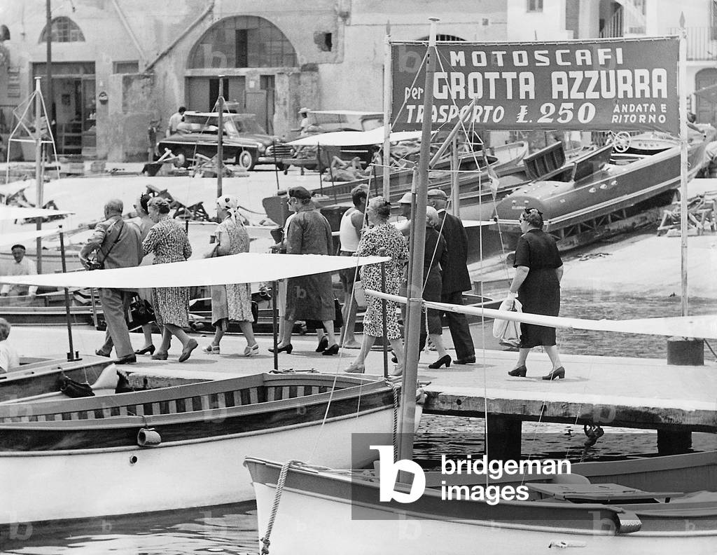 German tourists in the port of Capri, 1958 (b/w photo)