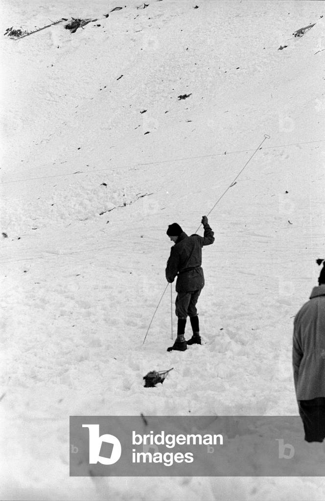Mountain rescuers in action after an avalanche, 1961 (b/w photo)