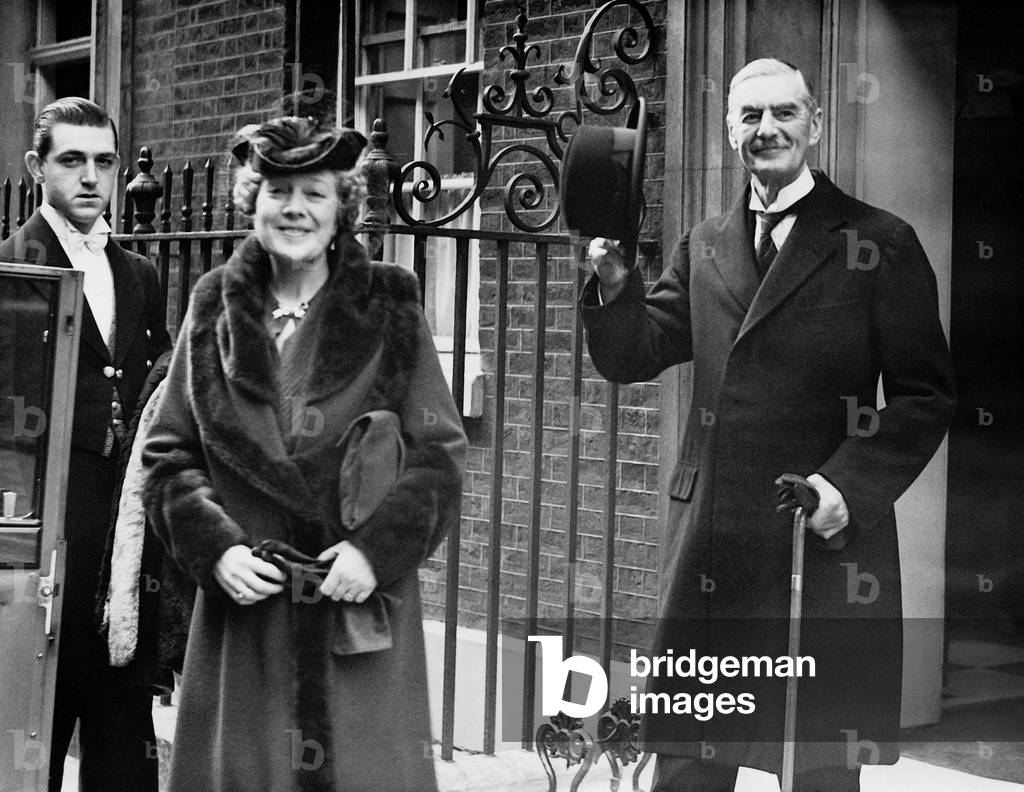 Chamberlain and his wife in front of Downing Street, 1939 (b/w photo)