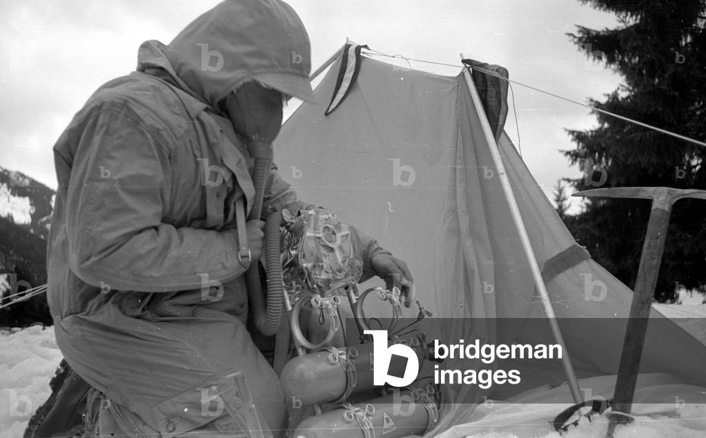 Mountaineer Mathias Rebitsch during preparations, 1954 (b/w photo)