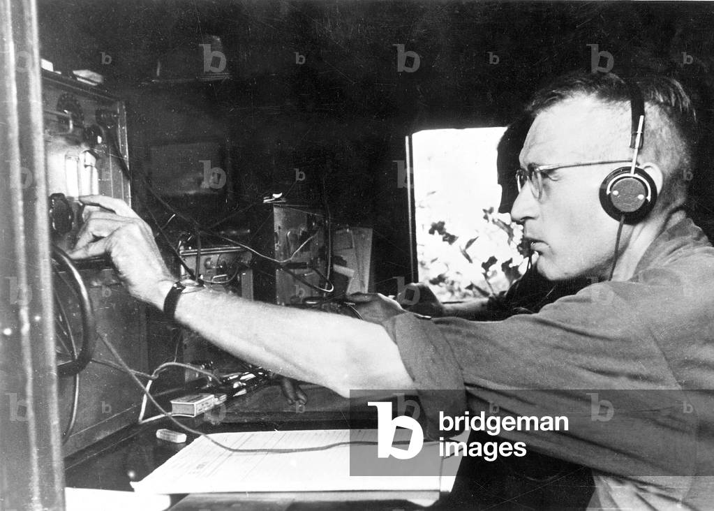 Radio operators on the radio equipment in the radio car (b/w photo)