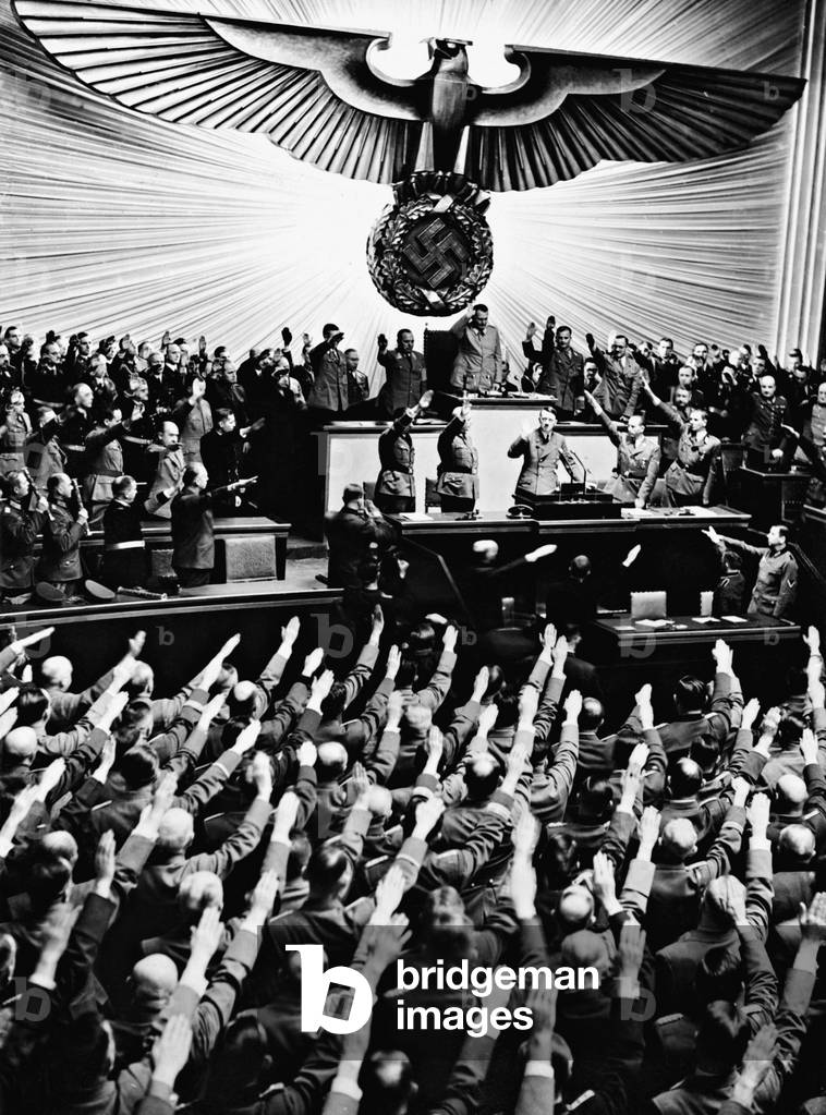 Reichstag members welcome Adolf Hitler at the lectern, 1941 (b/w photo)
