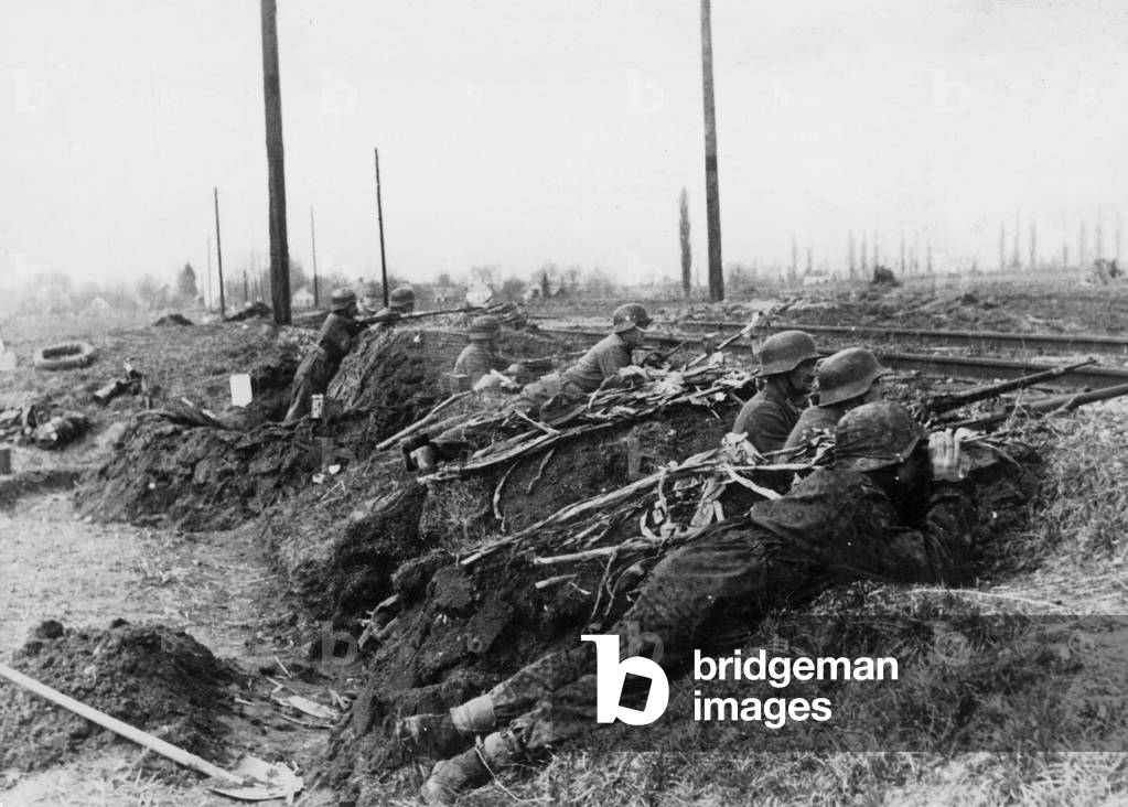 SS Panzer Grenadiers in a Hungarian railway embankment, 1945 (b/w photo)