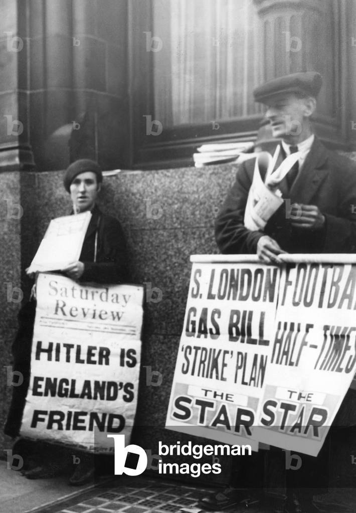 Newspaper salesman in Great Britain, 1936 (b/w photo)