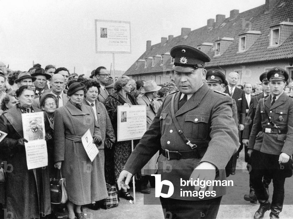 Relatives wait for homecomers, october 1955 (b/w photo)