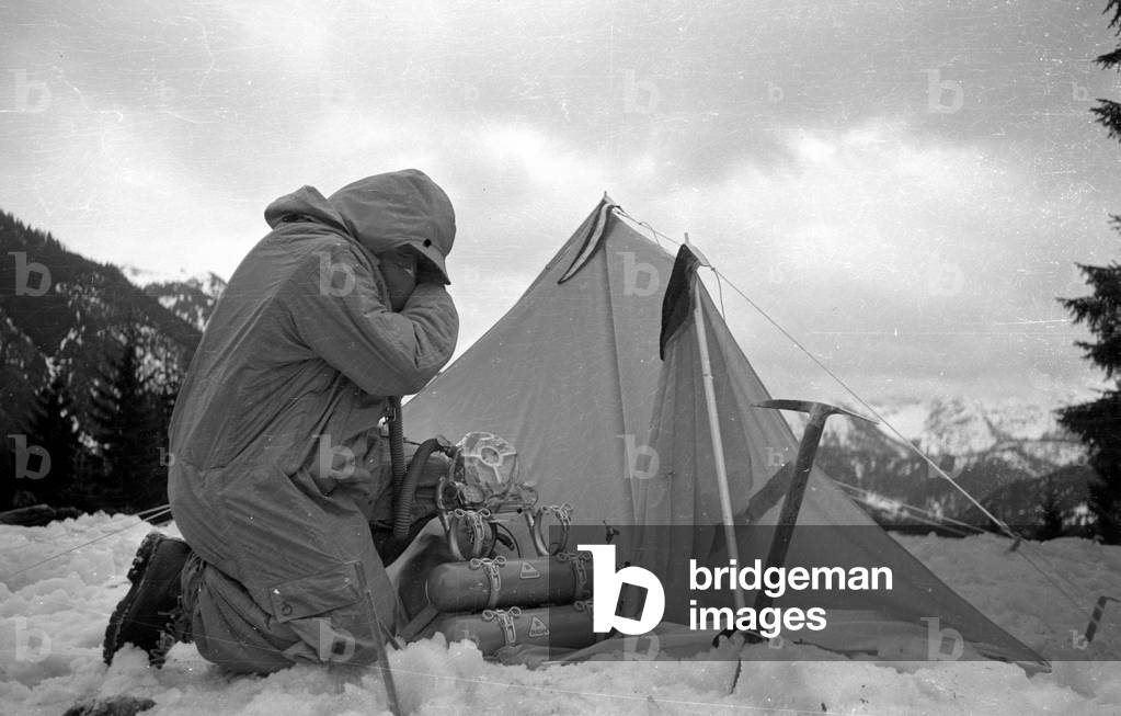 Mountaineer Mathias Rebitsch during preparations, 1954 (b/w photo)
