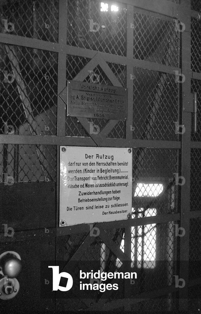 Elevator door in the Mathaeser Complex in Munich, 1960s (b/w photo)