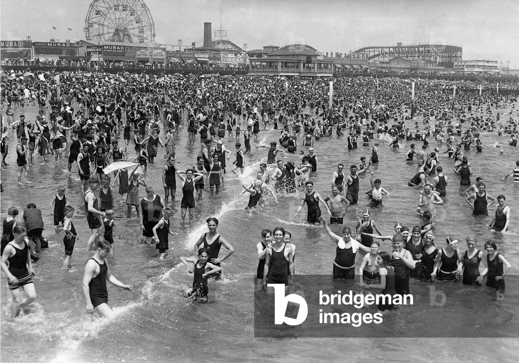 New York inhabitants recover on the beach of Coney Iceland, 1928 (b/w photo)