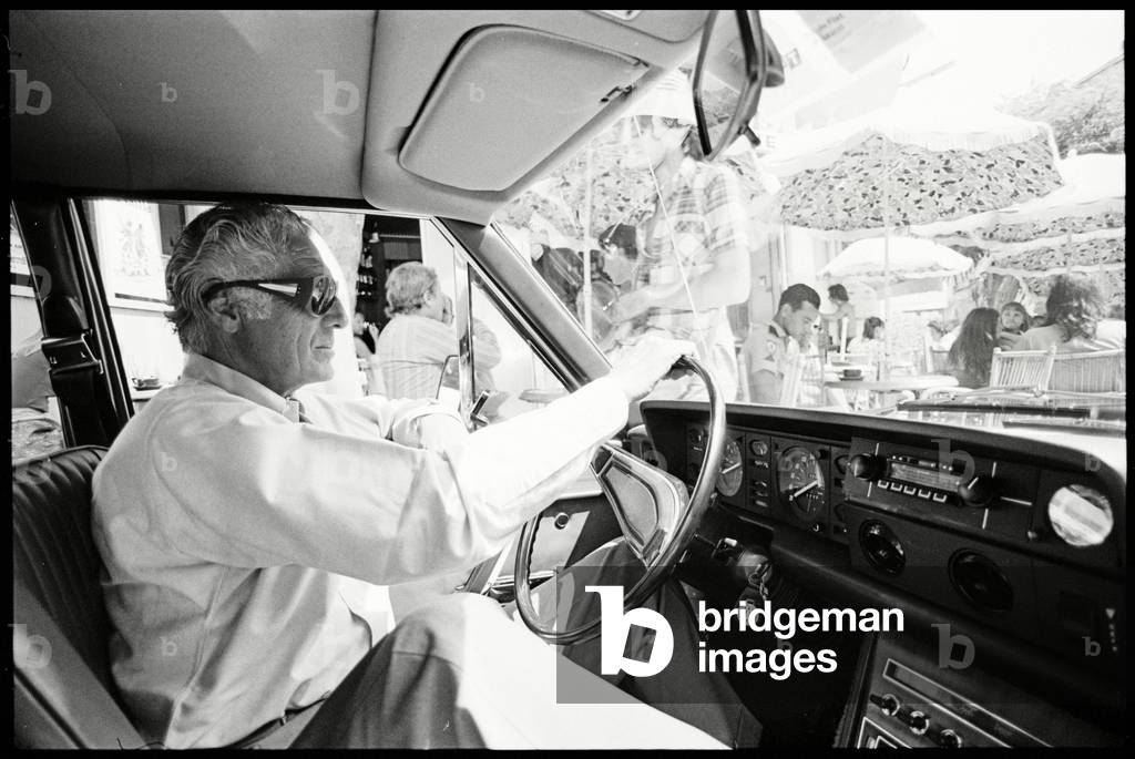 Gianni Agnelli in a Fiat in Corsica, 1975 (b/w photo)