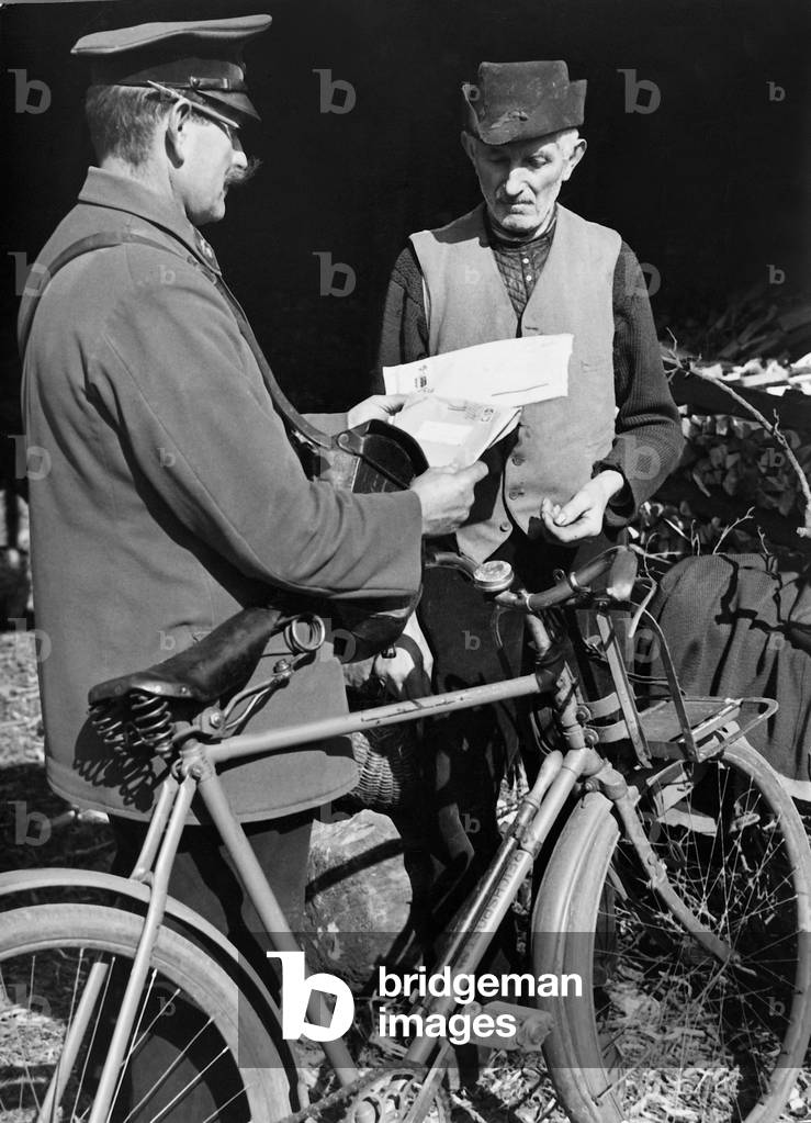 Rural postman during the letter delivery, 1936 (b/w photo)