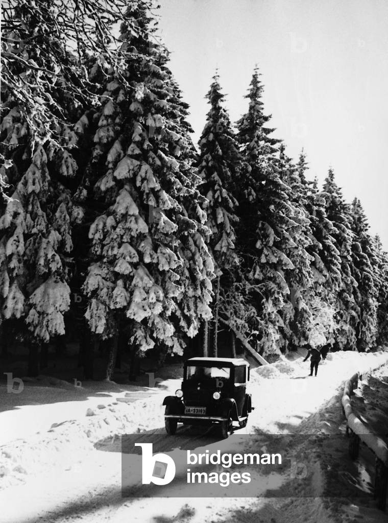 Car traffic in the winter, 1934 (b/w photo)