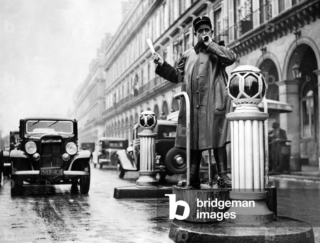 Traffic policeman in Paris, 1936 (b/w photo)