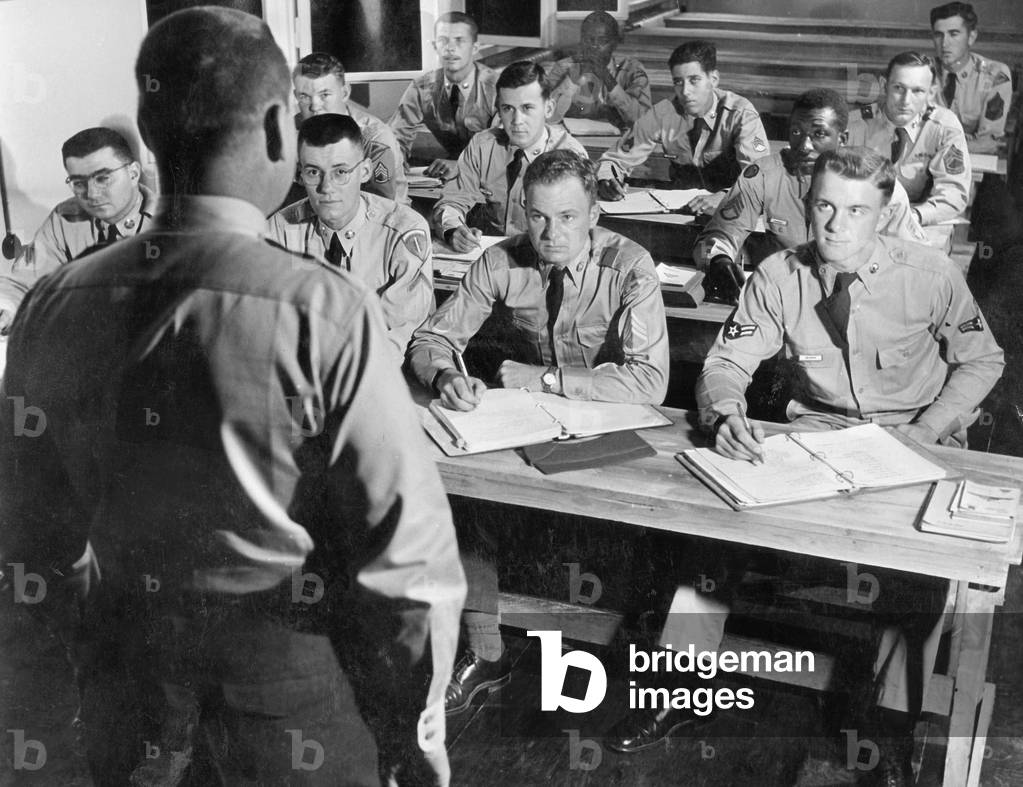 American students in uniforms during a lecture, around 1965 (b/w photo)