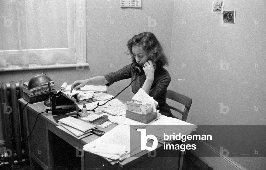 Woman on the phone in London, 1960 (b/w photo)