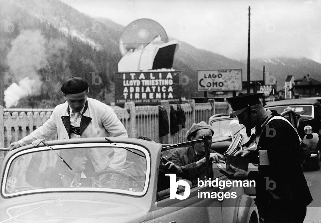 Italian border guards at a passport control in Brenner, 1938 (b/w photo)