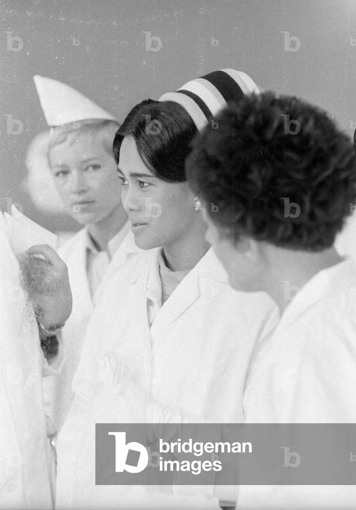 The Thai royal couple in a fish factory in Bremen, 1966 (b/w photo)