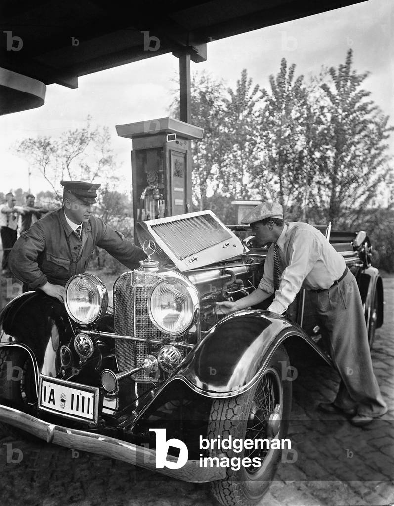 Willy Fritsch at a gas station, 1933 (b/w photo)