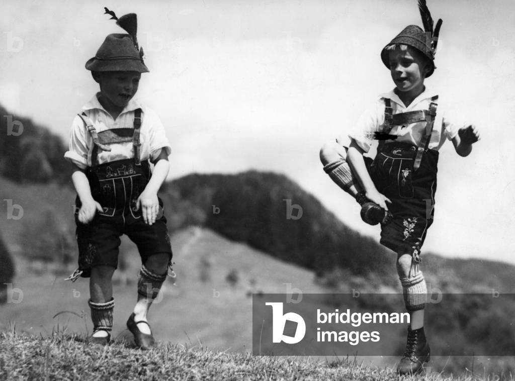 Two boys performing Schuhplattln, 1933 (b/w photo)