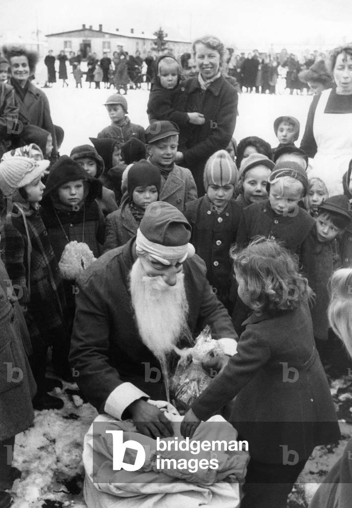 Saint Nicholas in a western german refugee camp, 1952 (b/w photo)