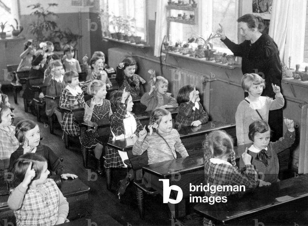 Education in a primary school, 1934 (b/w photo)