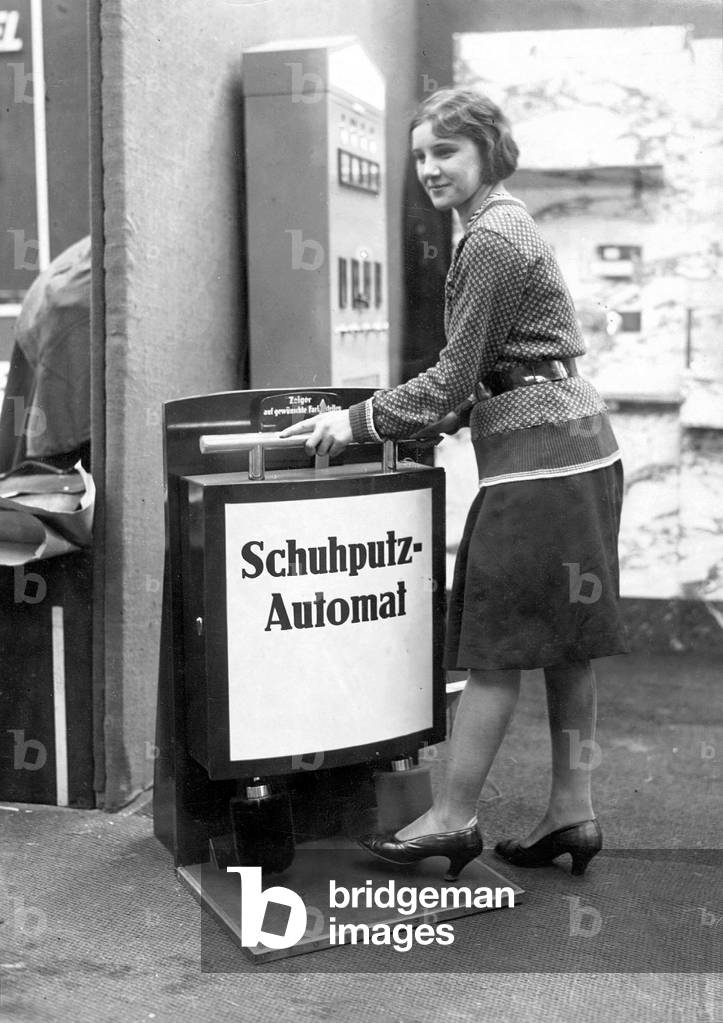 Automated shoe polisher, 1934 (b/w photo)