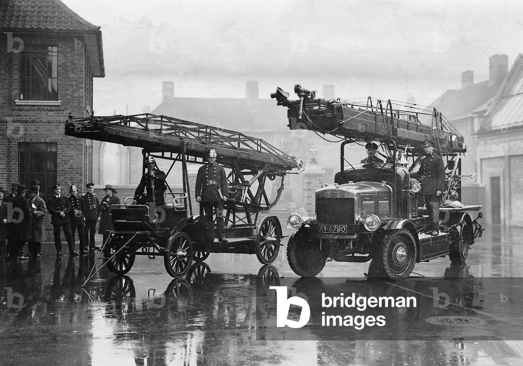 Fire engine and fire truck in front of fire station in Leicester, 1928 (b/w photo)