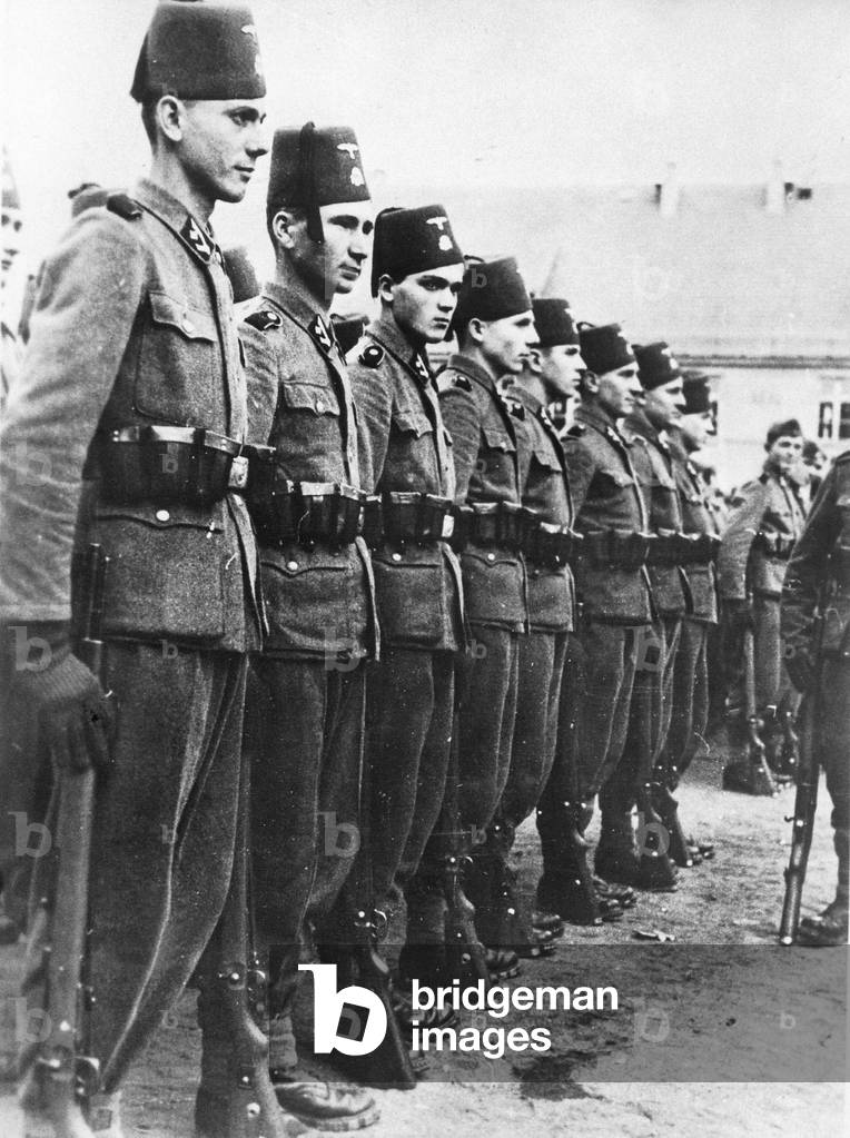 Bosnian members of the Weapon-SS while exercising, 1943 (b/w photo)